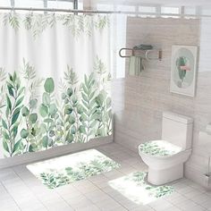 a bathroom with a shower curtain, toilet and rugs