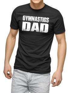 a man wearing a black t - shirt with the words gymnastics dad printed on it