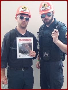 two men in hard hats and safety gear holding up a missing poster with the caption missing