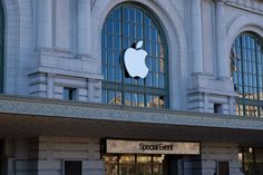 an apple store front with the logo on it