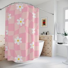 a pink and white shower curtain with daisies on it in a bathroom next to a bathtub