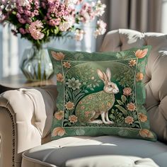 a decorative pillow with a rabbit on it