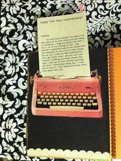 an old - fashioned typewriter with a note attached to it