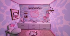 a bathroom decorated in pink and purple with hello kitty rugs on the floor next to the toilet