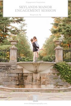 an engaged couple standing on top of a fountain in the middle of a park with text overlay that reads skylands manor engagement session