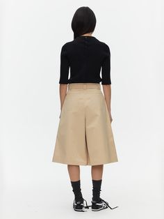 Midi length culotte pants with snap closures on the belt and pockets. Featuring one accent belt loop in leather. - Available in 2 colors- Midi length- Wide leg Wide Leg Cropped Pants With Belt Loops For Work, Cropped Wide Leg Pants With Belt Loops For Work, Beige Belted Bottoms For Work, Chic Culottes With Belt Loops For Workwear, Chic Workwear Culottes With Belt Loops, Beige Cropped Wide Leg Pants For Work, Belted Knee-length Workwear Bottoms, Chic Culottes With Belt Loops, Modern Knee-length Workwear Bottoms