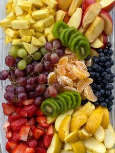 an assortment of fruit is arranged in a rectangle