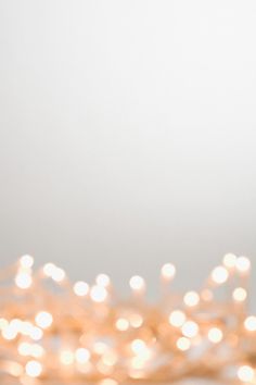 a bunch of lights that are sitting on a table in front of a white wall