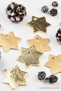 gold and silver christmas ornaments with pine cones