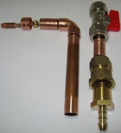 two different types of pipes and fittings on a white surface