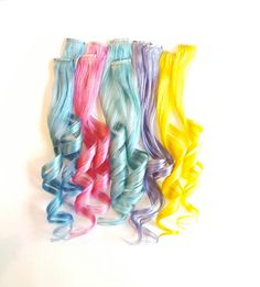 "This listing is for 18\" long PASTEL SKY BLUE, LIGHT PINK, MINT, LAVENDER or YELLOW colored clip-in hair extensions. Choose the color and quantity you would like from the drop down menus. -1.25\" wide and 18\" long 100% real Remy human hair extensions -each extension is approximately 4-6 grams of hair -wefts are doubled, then sewn together and then are sewn on to a 1.25\" mini clip -they easily clip into existing hair -adds a pop of fun color -add multiple quantities of extensions for more pops Mermaid Hair Waves, Turquoise Hair Ombre, Baby Blue Hair, Ariel Hair, Bleached Tips, Turquoise Ombre