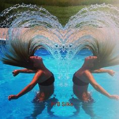 two women are in the water with their hair flying out of them's mouths