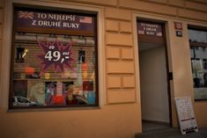 a store front with the number forty nine on it's window and sign in front