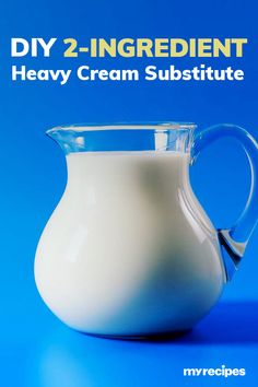 a glass pitcher filled with milk sitting on top of a blue tablecloth next to the words diy 2 - ingredient heavy cream substance