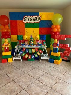 a lego themed birthday party with balloons and decorations