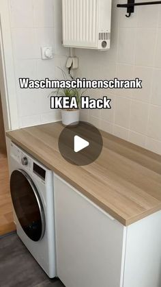 a washer and dryer sitting on top of a wooden counter in a kitchen