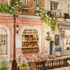 an image of a bakery shop in the middle of town with flowers growing on the windows