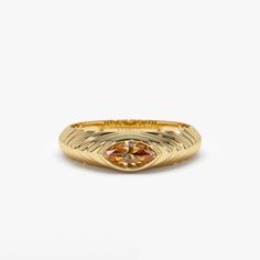 This 14k Gold step beveled ring features a radiant 7x3.5 MM marquise cut Citrine, the birthstone for November. The ring has a modern design, perfect for everyday wear, and the Citrine gemstone adds a pop of color to the piece. The step beveled design adds depth to the ring and the 14k Gold gives it a touch of luxury. This ring is perfect for anyone born in November or anyone who loves the color yellow. Features: * Made to Order * Gold Kt: 14K Solid Gold (also available in 18K) * Available Gold Colors: Rose Gold, Yellow Gold, White Gold * Marquise Citrine: 1 pc 7 x 3.5 MM * Citrine Carat Weight: 0.35 ctw * Ready to Ship in 7-10 Business days  ▶ See more of our Gemstone Jewelry here- https://etsy.me/3CGRdMI ▶ See our storefront here - http://etsy.me/2lUcVnH  ▶ All store sections here * Diamo Luxury Faceted Yellow Gold Rings, November Birth Stone Rings, Luxury Gold Marquise Signet Ring, Gold Marquise Topaz Promise Ring, Gold Marquise Ring With Bezel Setting, Marquise Polished Promise Ring, Gold Marquise Birthstone Ring, Gold Marquise Birthstone Ring With Gemstone, Beveled Ring