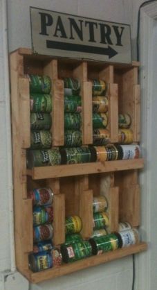 an organized pantry with cans and cans on the shelf next to it's door