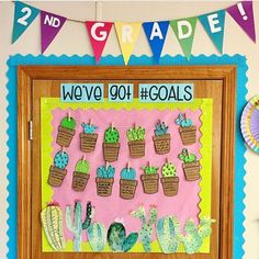 a bulletin board decorated with cactuses and plants for the first grade classroom to learn