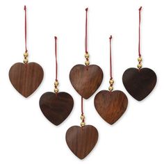 six wooden hearts hanging from red string