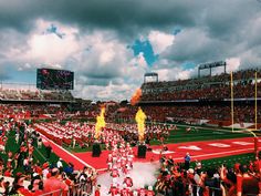 a football stadium filled with fans and fire