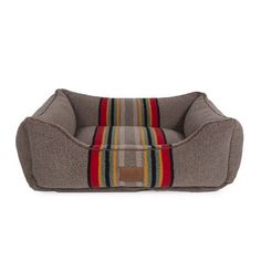 a dog bed with a striped design on the front and bottom, in grey fabric