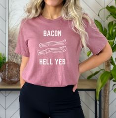 Bacon: Hell Yes! This T-shirt was designed for the Bacon Lover in your life in mind. You want Bacon? Hell Yes- Said everyone ever. This beautiful print is a must have for all Breakfast Food lovers out there. Get 'em while they're hot!   PRODUCT DETAILS AND SIZING Design is printed on the beautiful Bella Canvas 3001.  This classic unisex jersey short sleeve tee fits like a well-loved favorite. Soft cotton and quality print make users fall in love with it over and over again. These t-shirts have-r Bacon Gifts, Bacon Shirt, Bacon Lover, Funny Gifts For Her, Food Shirt, Funny Gifts For Him, Tshirt Funny, Breakfast Food, Funny Gifts