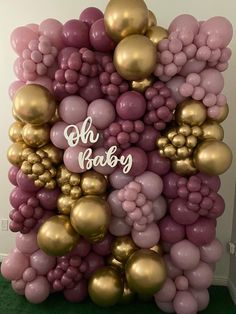 a bunch of balloons that are in the shape of a baby's first birthday sign