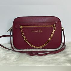 Michael Kors Jet Set Crossbody Bag Color Is Burgundy Tan Color Interior Size Is Medium Gold Toned Hardware Top Close Zipper Adjustable Strap New With Tags Burgundy Crossbody Shoulder Bag With Branded Hardware, Michael Kors Burgundy Bag, Michael Kors Burgundy Bags With Branded Hardware, Burgundy Crossbody Bag With Chain Strap, Elegant Michael Kors Burgundy Bag, Navy Crossbody Bag, Travel Clutch, Michael Kors Selma, Color Interior