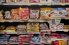 an oil painting of food on shelves in a grocery store with dog biscuits and cat treats