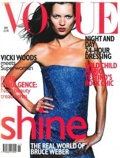 a magazine cover with a woman in a blue dress on it's front page