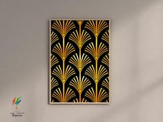 a black and gold art deco poster hanging on a wall