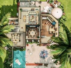 an aerial view of a house with a pool and palm trees in the foreground