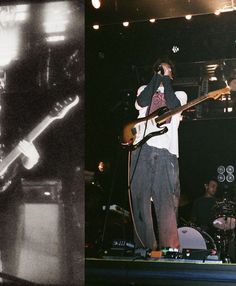 a man standing on top of a stage while holding a guitar in front of him