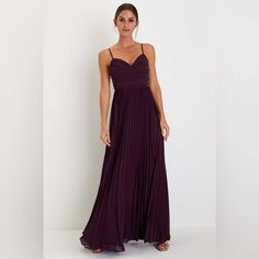 a woman in a long purple dress