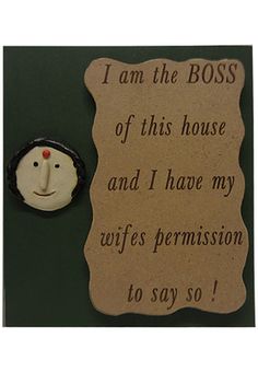 a card with a button on it that says i am the boss of this house and i have my wife's permission to say so