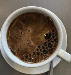 there is a cup of coffee on the saucer