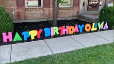 there is a happy birthday sign in the front yard