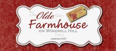 the olde farmhousehouse on windmill hill sign is hanging from a red wall and has a tag attached to it