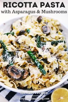 a white bowl filled with pasta and mushrooms