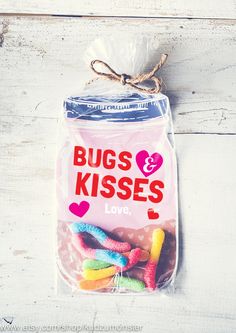 a bag filled with lots of candy on top of a wooden table