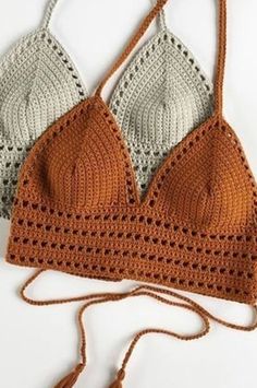 two crocheted bras with tasselled straps on the top and bottom