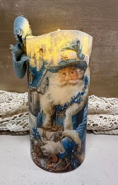 a glass vase with a santa clause on it