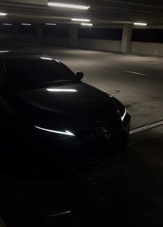 a car parked in a parking garage at night