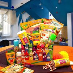 an assortment of children's toys sitting on top of a table in a room