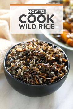 a bowl filled with wild rice next to another bowl full of other food on a table