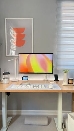 a desk with a computer monitor, keyboard and mouse