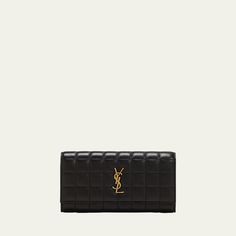 Saint Laurent wallet in quilted leather Features YSL logo lettering  Envelope flap top with snap closure  Interior, card slots and zip pocket Golden hardware  Approx. 7.4"W x 3.9"H x 1.6"D Made in Italy Luxury Quilted Leather Wallet On Chain, Yves Saint Laurent Wallet, Ysl Quilted Leather Clutch, Black Ysl Wallet, Ysl Wallet On Chain, Saint Laurent Wallet, Quilted Leather, Zip Pockets, Saint Laurent