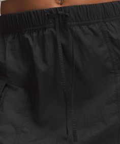 Switch Up Your Look In A Cinch. Pull And Tie The Side Seams Of This Lightweight Cargo Skirt For More Volume. Designed For Casual. Relaxed Fit Is Roomy Through Glutes And Thighs. Pull And Tie The Drawcords At The Hem To Change The Shape. Elasticated Waistband With Adjustable Drawcord. Cargo Pockets, One With A Hidden Card Sleeve. | Nylon Cargo Mini Skirt Lululemon Nylon Bottoms With Elastic Waistband, Casual Nylon Bottoms By Lululemon, Lululemon Casual Nylon Bottoms, Lululemon Nylon Bottoms With Pockets, Sporty Nylon Bottoms By Lululemon, Cargo Mini Skirt, Card Sleeve, Cargo Skirt, Women's Skirts